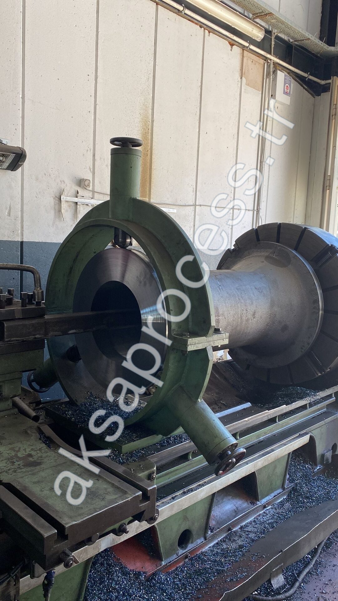 A grinding-mill component being machined on a large horizontal lathe in our workshop